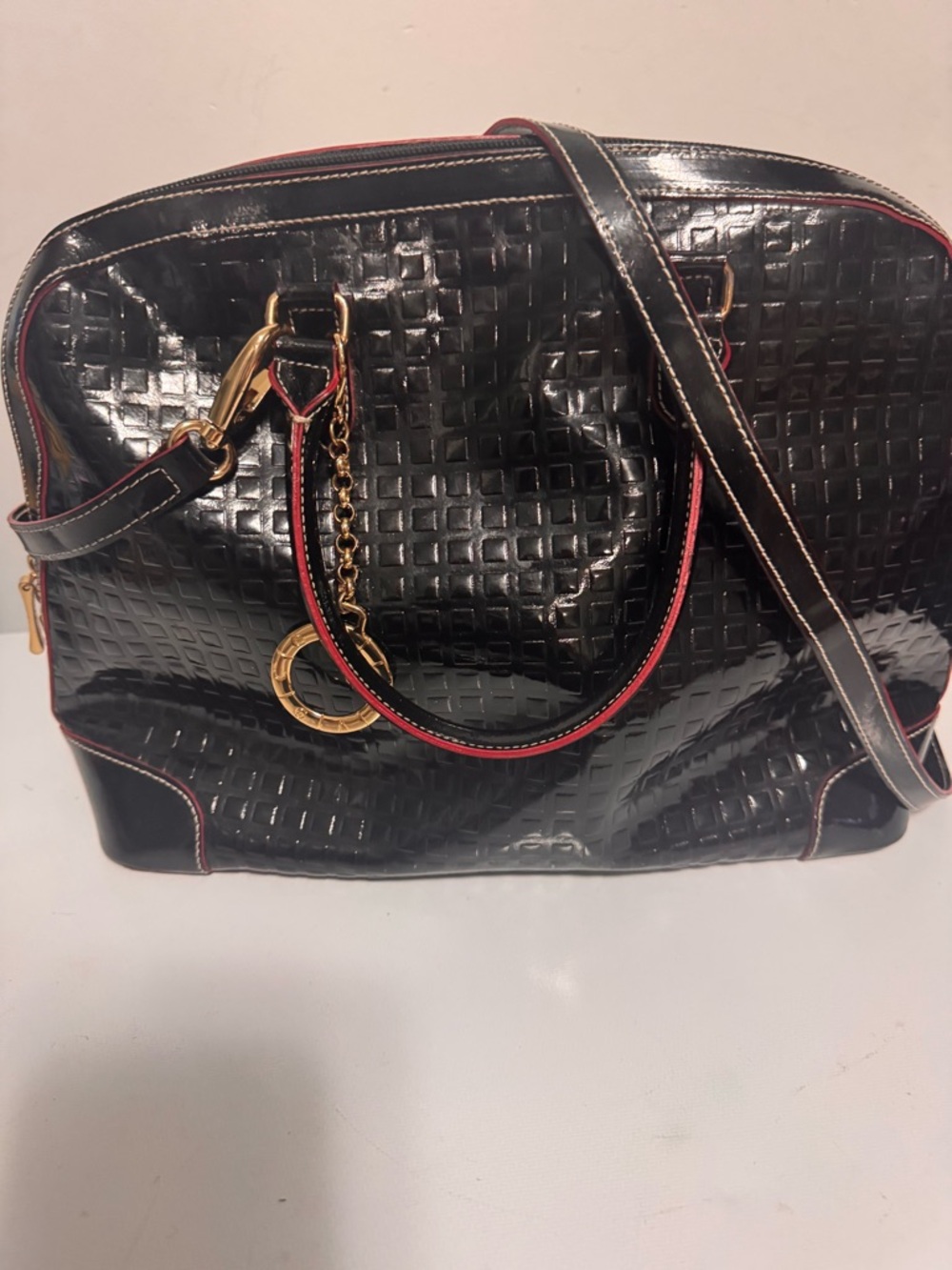 Black Quilted Patent Crossbody Bag with Red Trim and Gold Accent